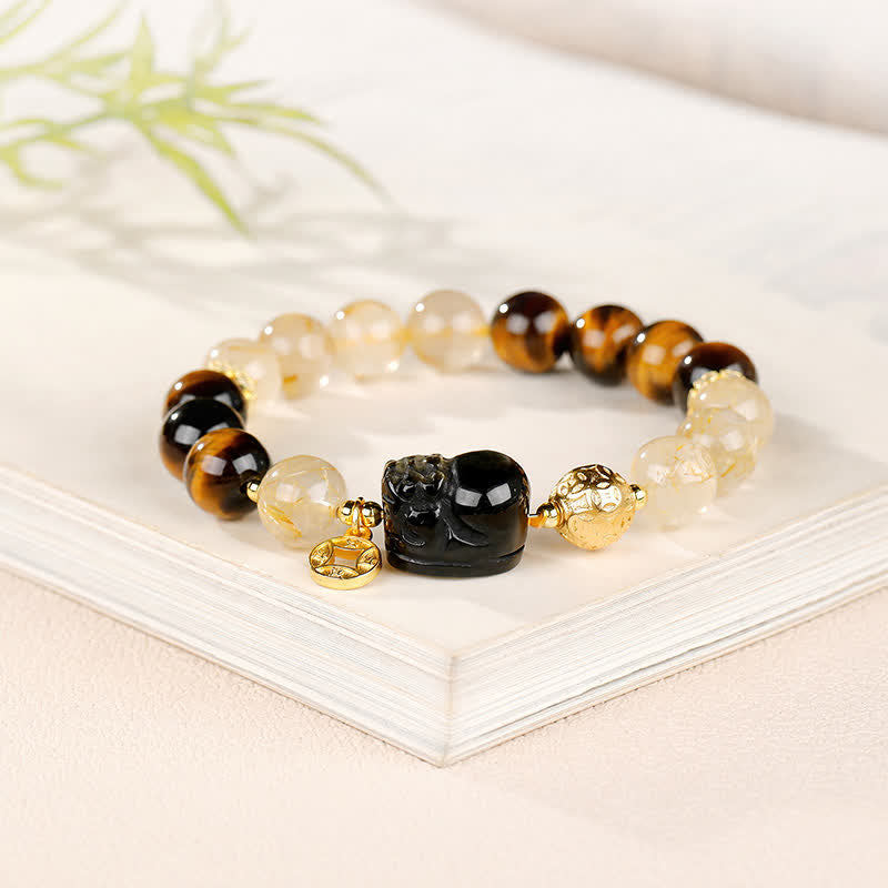 Buddha Stones Braccialetto portafortuna con perline di quarzo rutilato dorato e occhio di tigre Pi Xiu del Feng Shui. - image 2