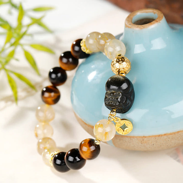 Buddha Stones Braccialetto portafortuna con perline di quarzo rutilato dorato e occhio di tigre Pi Xiu del Feng Shui. - image 3