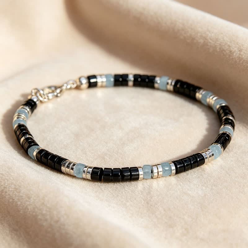 Buddha Stones Bracciale elastico protettivo con perline in onice nera e calcedonio blu - image 1