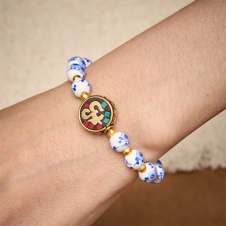 Buddha Stones Braccialetto con perline OM in rame, porcellana blu e bianca, simbolo di compassione. - image 3