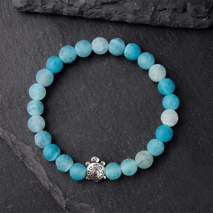 Buddha Stones Braccialetto con perline a forma di tartaruga in agata blu screpolata, ideale per calmare gli animali. - image 1