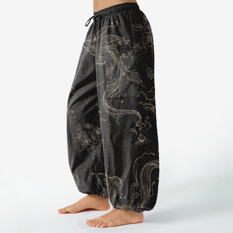 Buddha Stones Pantaloni harem da donna in cotone con elastico in vita e motivo floreale con carpe koi, dotati di tasche laterali. - image 1