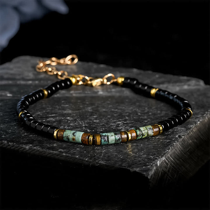 Buddha Stones Bracciale protettivo con perline rotonde in onice nera e turchese - Onice nero e turchese (Circonferenza del polso: 18-20 cm) - image 0