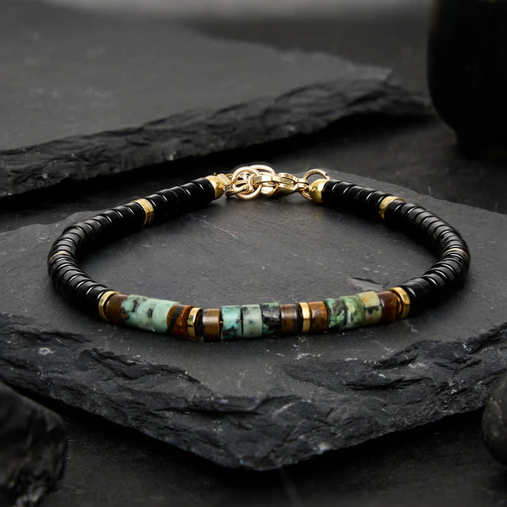 Buddha Stones Bracciale protettivo con perline rotonde in onice nera e turchese - image 1