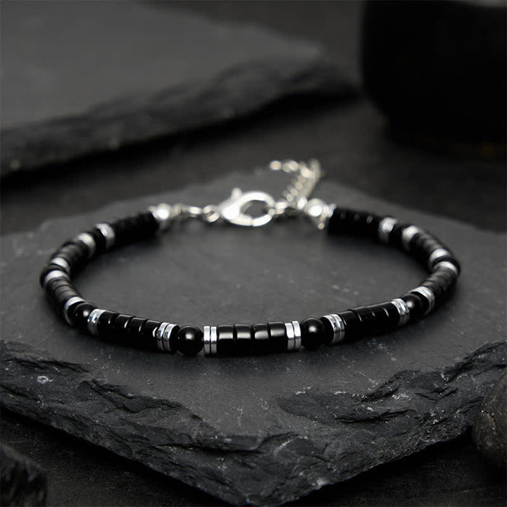 Buddha Stones Bracciale protettivo con distanziatori cilindrici satinati in onice nera - image 10
