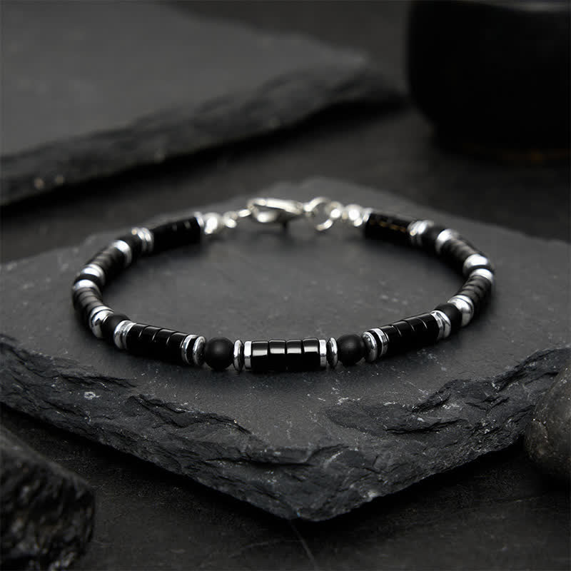 Buddha Stones Bracciale protettivo con distanziatori cilindrici satinati in onice nera - image 1