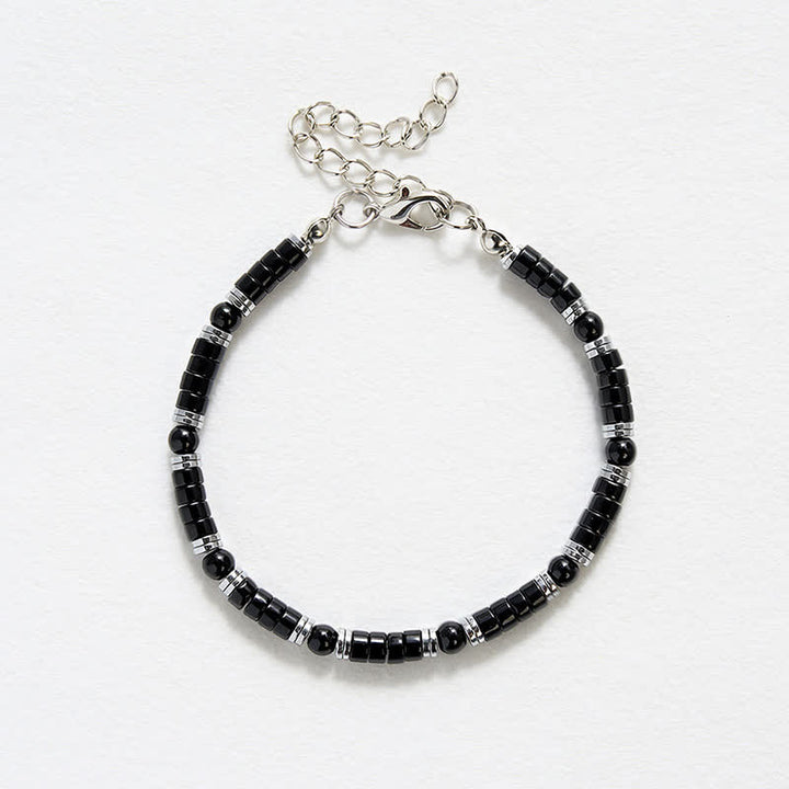 Buddha Stones Bracciale protettivo con distanziatori cilindrici satinati in onice nera - image 12