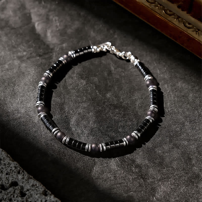 Buddha Stones Bracciale protettivo con distanziatori cilindrici satinati in onice nera - image 2