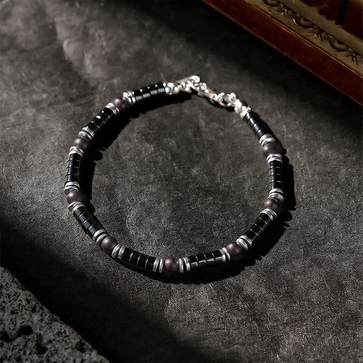 Buddha Stones Bracciale protettivo con distanziatori cilindrici satinati in onice nera - image 2