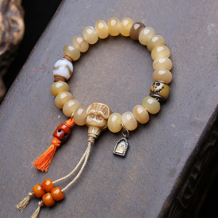 Buddha Stones Bracciale tibetano con perline dzi in osso, Signore dei cadaveri, Protezione della foresta - Signore della Foresta dei Cadaveri - 12×7 mm - image 0