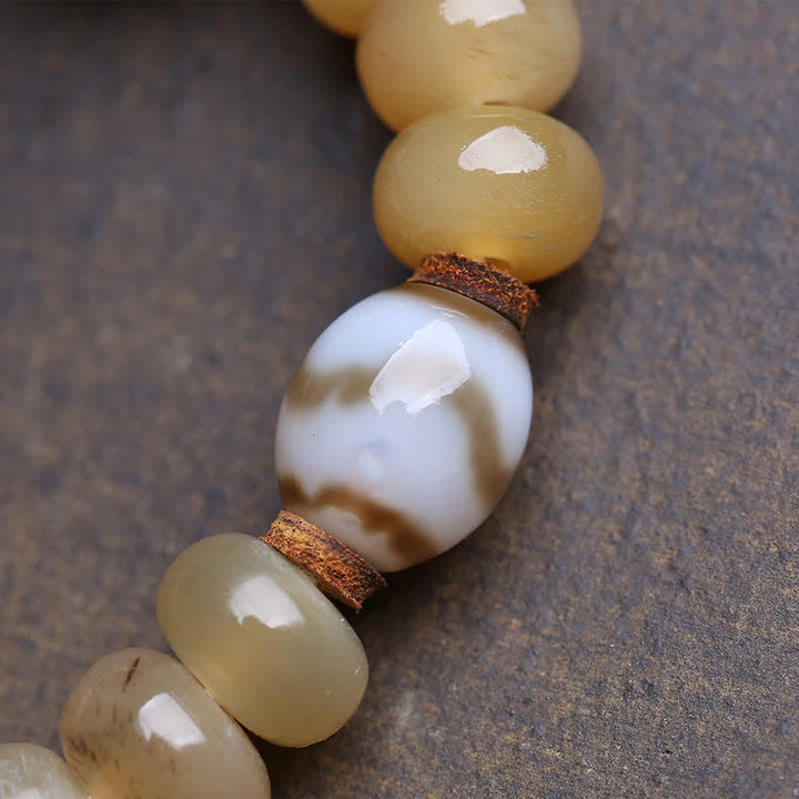 Buddha Stones Bracciale tibetano con perline dzi in osso, Signore dei cadaveri, Protezione della foresta - image 1