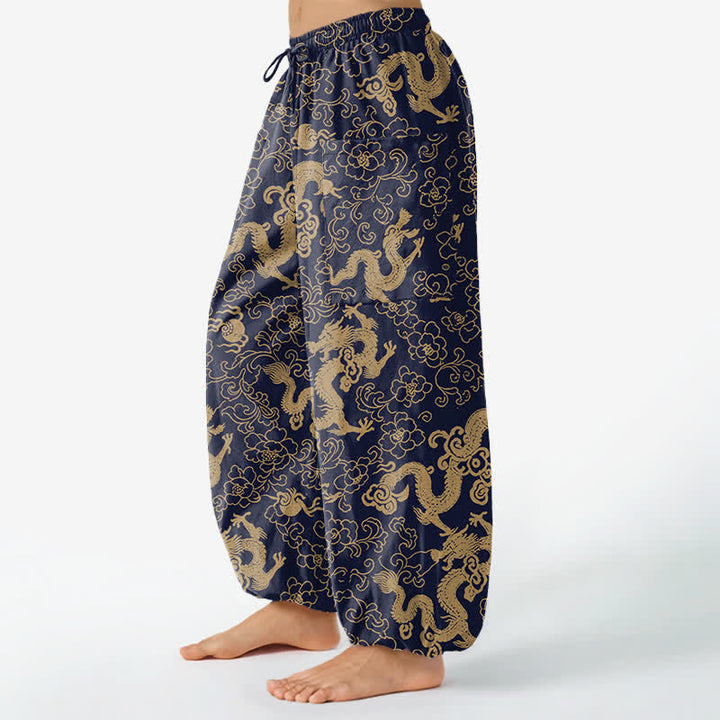 Buddha Stones Pantaloni harem da donna in cotone con elastico in vita e motivo floreale a drago dorato, con tasche laterali. - image 1