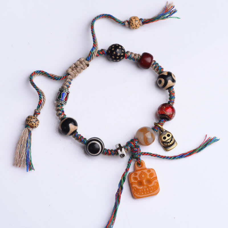 Buddha Stones Braccialetto portafortuna tibetano con perline Dzi, osso intrecciato e cordino multicolore. - image 1