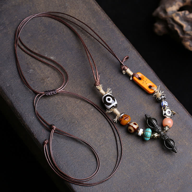 Buddha Stones Collana tibetana con perline Dzi a tre occhi e simbolo di Vajra, portafortuna. - image 1