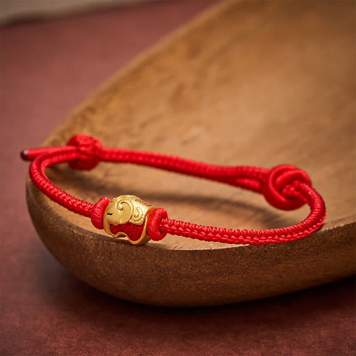 Buddha Stones Braccialetto Faith in rame con elefante e cordino rosso - image 1