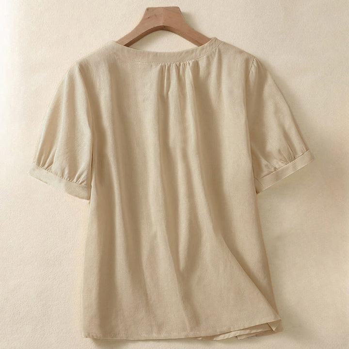 Camicia da donna casual a maniche corte con scollo rotondo e bottoni, con stampa Buddha Stones. - image 1