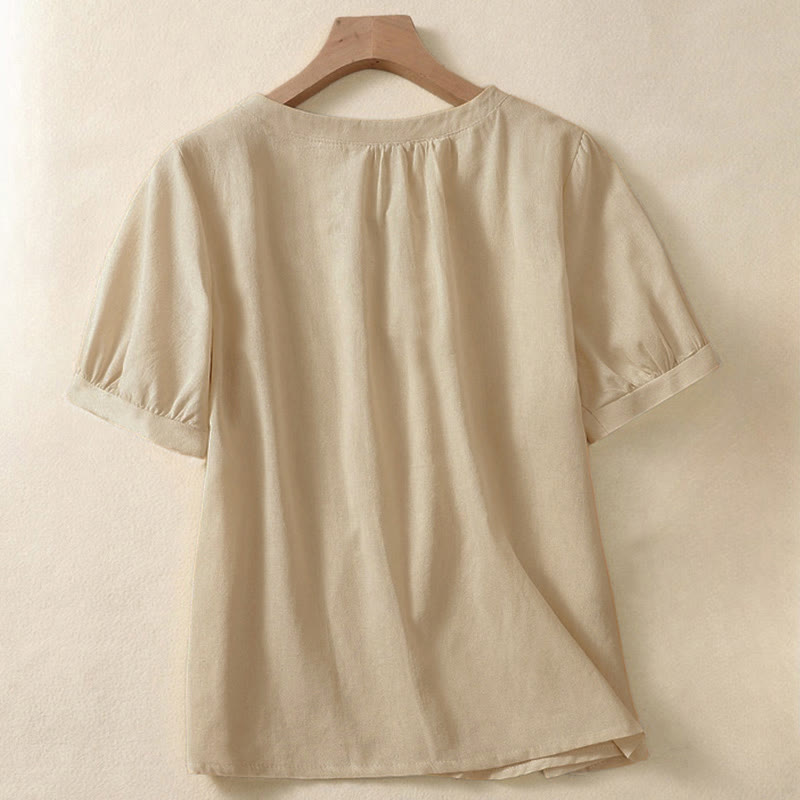 Camicia da donna casual a maniche corte con scollo rotondo e bottoni, con stampa Buddha Stones. - image 1