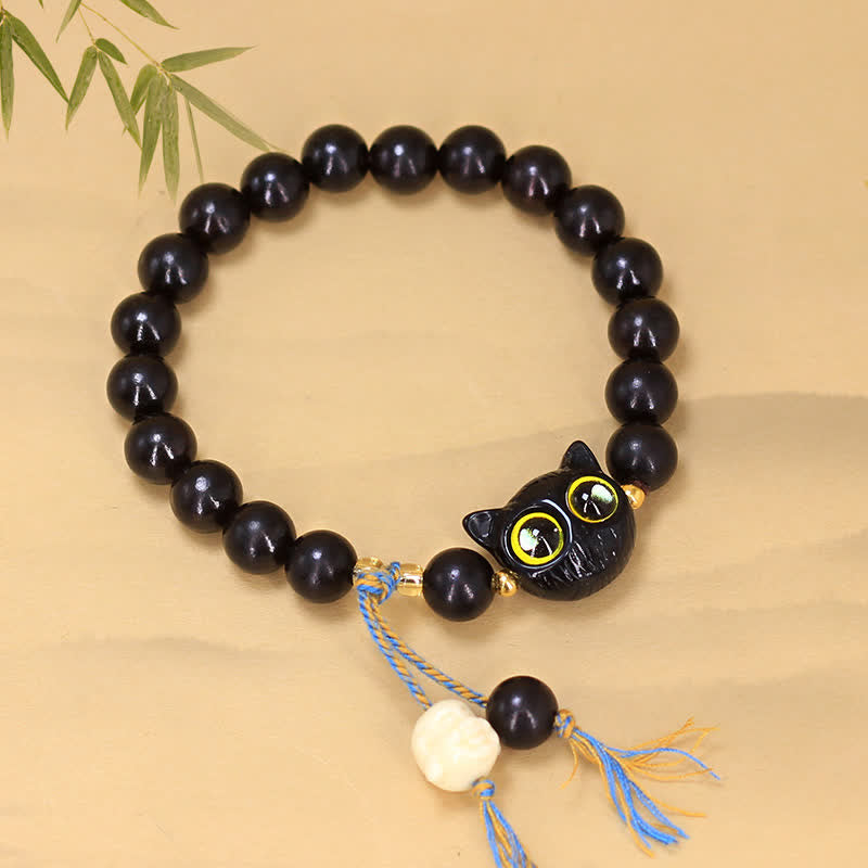 Buddha Stones Bracciale rotondo intrecciato con ciondolo a forma di gatto in legno d'ebano. - image 1