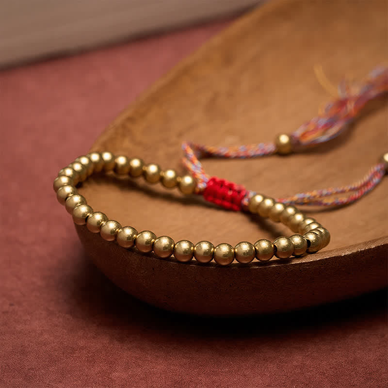 Buddha Stones Bracciale con perline di rame e filo rosso - image 1