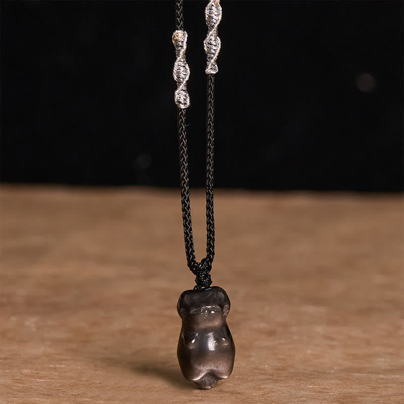 Buddha Stones Collana con ciondolo a forma di gatto in ossidiana con riflessi argentati e cordino intrecciato per un radicamento a terra. - image 2