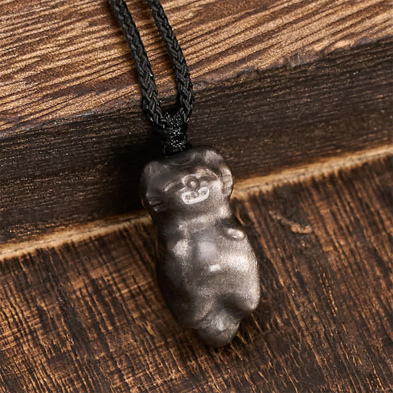 Buddha Stones Collana con ciondolo a forma di gatto in ossidiana con riflessi argentati e cordino intrecciato per un radicamento a terra. - image 3