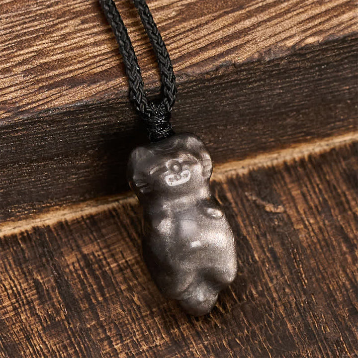 Buddha Stones Collana con ciondolo a forma di gatto in ossidiana con riflessi argentati e cordino intrecciato per un radicamento a terra. - image 3