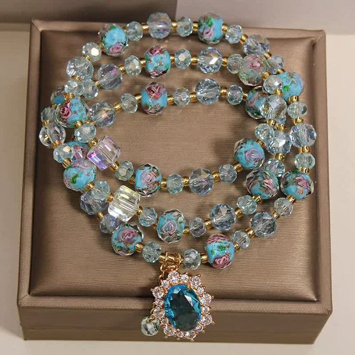 Buddha Stones Bracciale a triplo giro con ciondolo ovale floreale e perline di vetro Blue Liuli. - image 1
