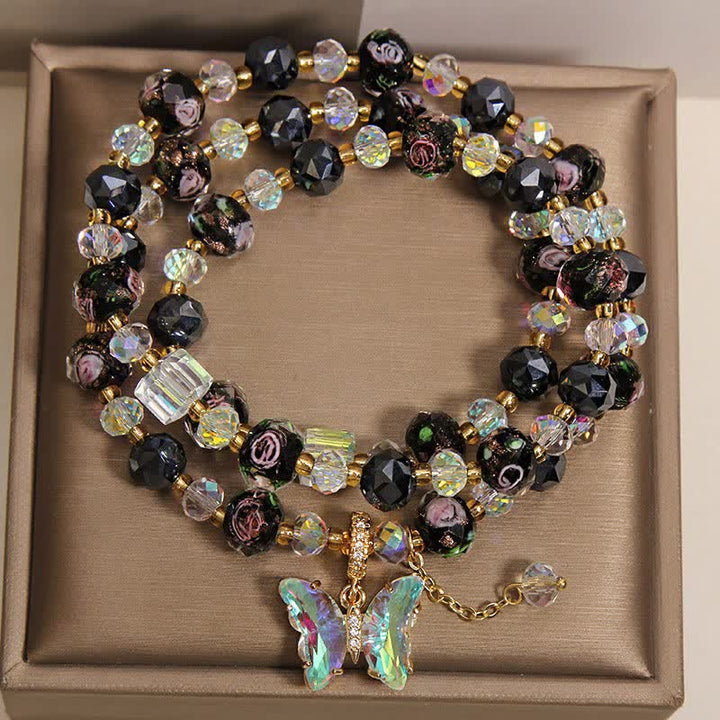 Buddha Stones Bracciale a triplo giro con perline di vetro Black Liuli, ciondolo a forma di rosa e farfalla. - image 1