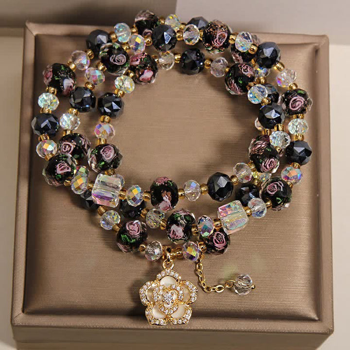 Buddha Stones Bracciale con ciondolo a forma di fiore di camelia e perline di vetro nere Liu Li, con connessione armonica. - image 1