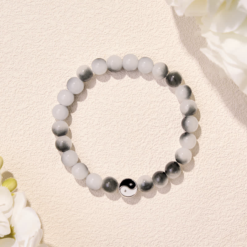 Buddha Stones Bracciale bicolore Yin Yang con perline piatte in lega e vetro. - image 1