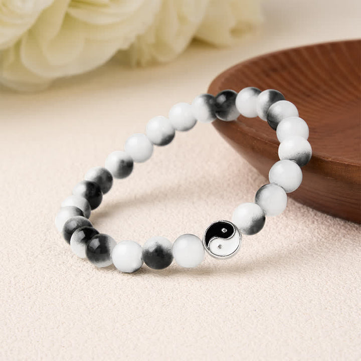 Buddha Stones Bracciale bicolore Yin Yang con perline piatte in lega e vetro. - image 2