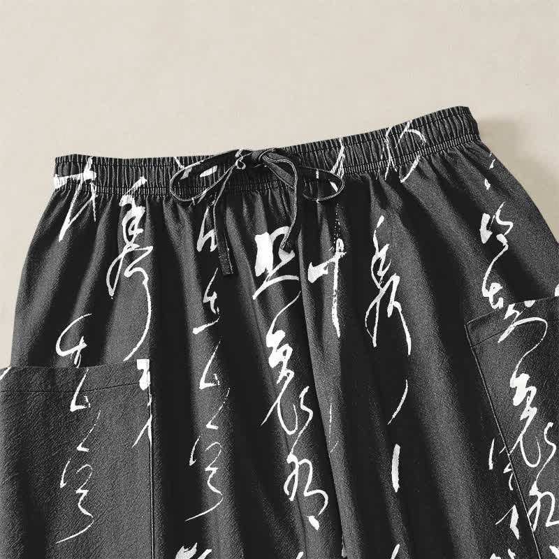Buddha Stones Pantaloni harem da donna in cotone con motivo calligrafico zen, elastico in vita e tasche laterali. - image 5