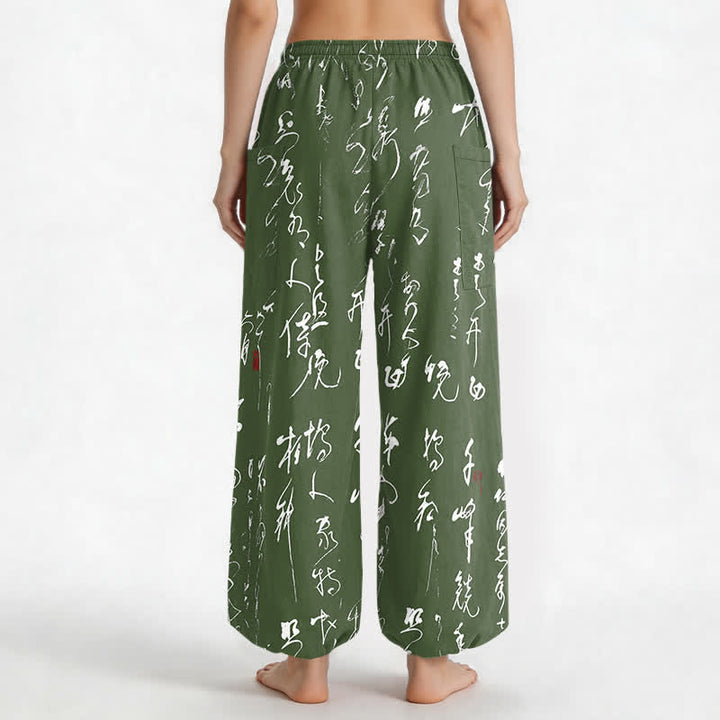 Buddha Stones Pantaloni harem da donna in cotone con motivo calligrafico zen, elastico in vita e tasche laterali. - image 9
