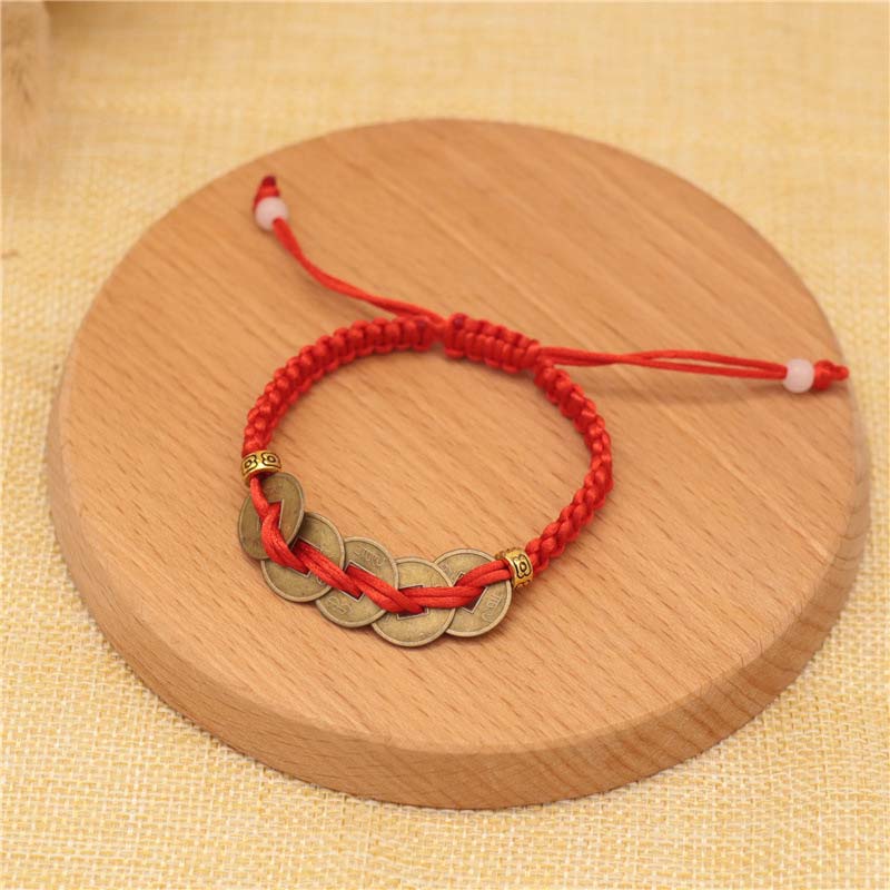Braccialetto intrecciato con corda rossa, moneta di rame e Buddha Stones