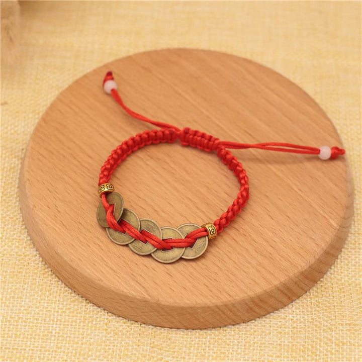Braccialetto intrecciato con corda rossa, moneta di rame e Buddha Stones