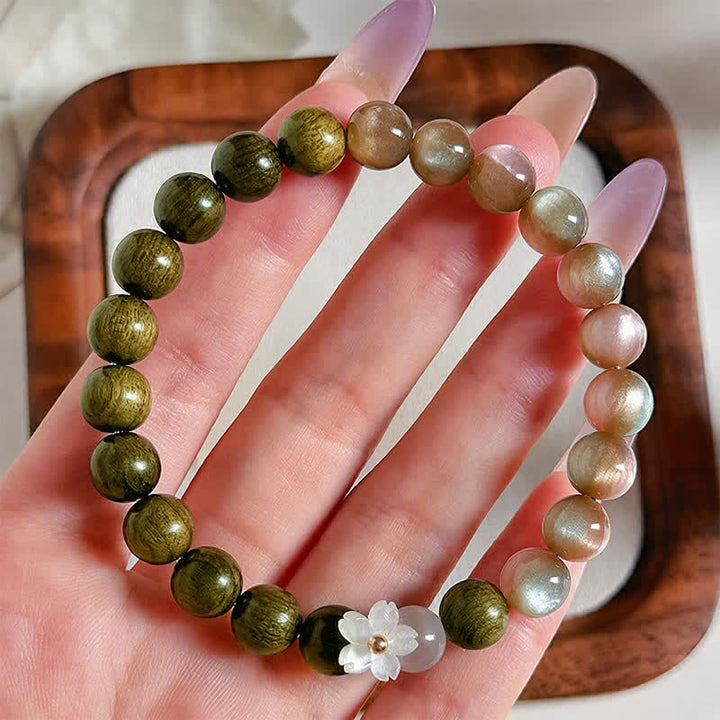Buddha Stones Bracciale Serenity con ciondolo a forma di fiore occhio di gatto in legno di sandalo verde. - image 3