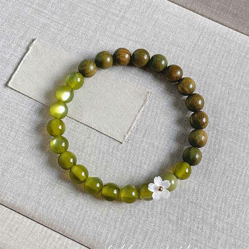 Buddha Stones Bracciale Serenity con ciondolo a forma di fiore occhio di gatto in legno di sandalo verde. - Pietra occhio di gatto da 8 mm - image 13