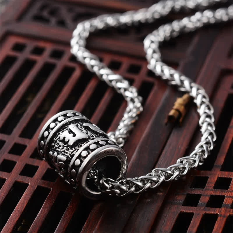 Buddha Stones Collana cilindrica in acciaio al titanio con rilievo Om Mani Padme Hum, simbolo di protezione e saggezza. - image 1