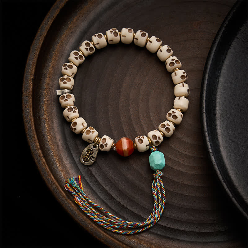 Buddha Stones Braccialetto di radicamento con perline d'osso tibetane, motivo "Signore dei cadaveri, teschio della foresta". - 9 × 6,3 mm - image 0
