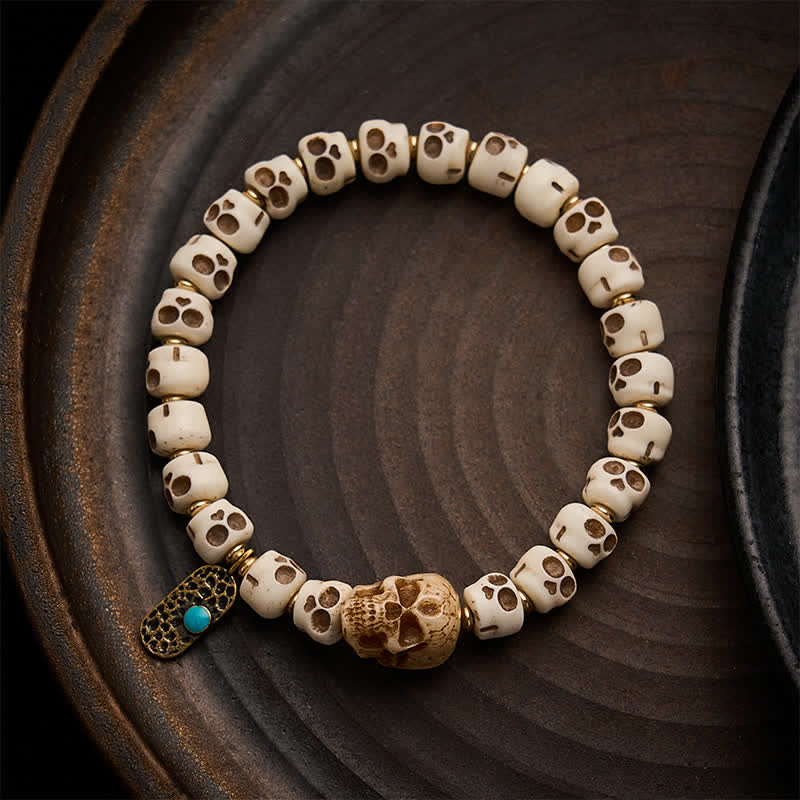 Buddha Stones Bracciale tibetano con perline d'osso intagliate a mano, motivo teschio della foresta "Signore dei cadaveri", forza e cambiamento. - 9×6,3 mm - image 0