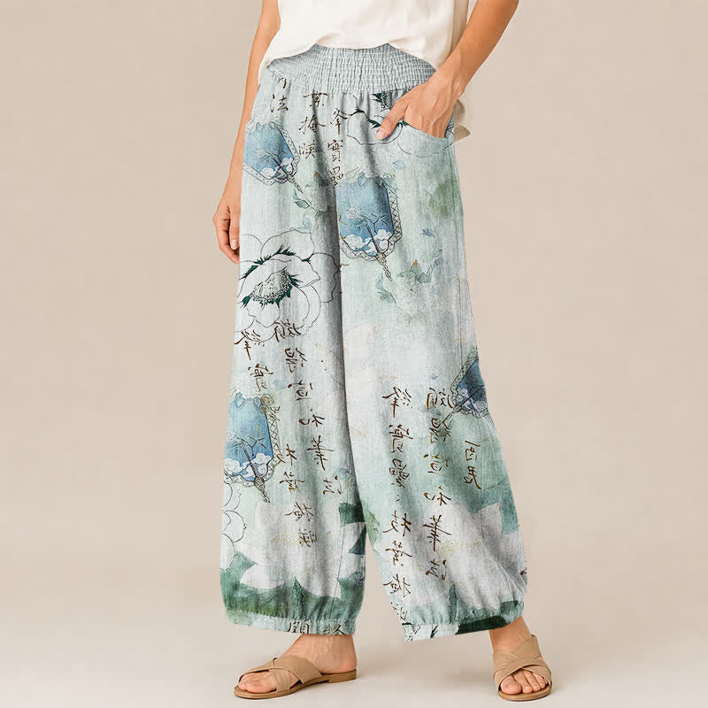 Buddha Stones Pantaloni harem da donna in cotone con motivo floreale acquerellato e calligrafia, vita elasticizzata e pieghe, con tasche. - image 1