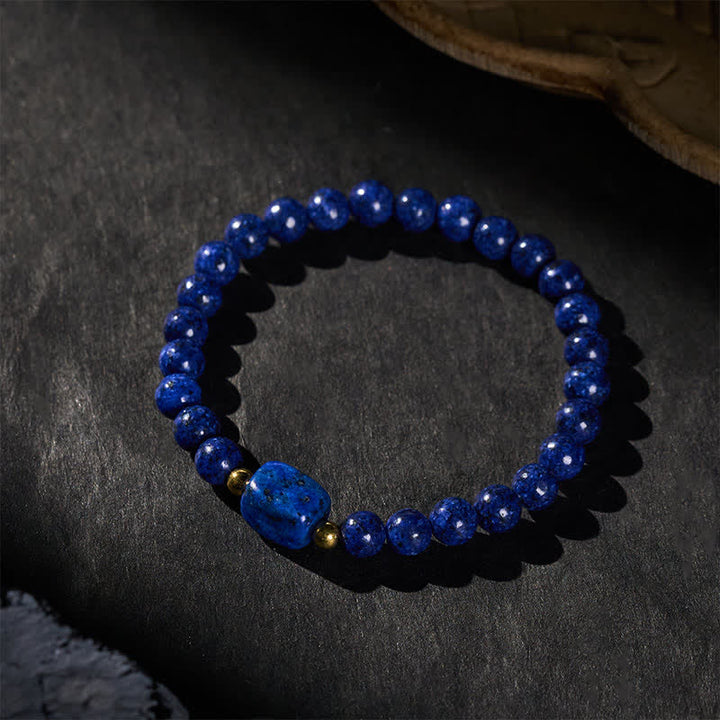 Buddha Stones Bracciale minimalista elastico con perline di lapislazzuli e simbolo di saggezza. - image 2