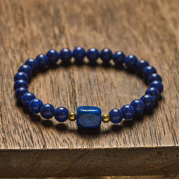 Buddha Stones Bracciale minimalista elastico con perline di lapislazzuli e simbolo di saggezza. - image 1
