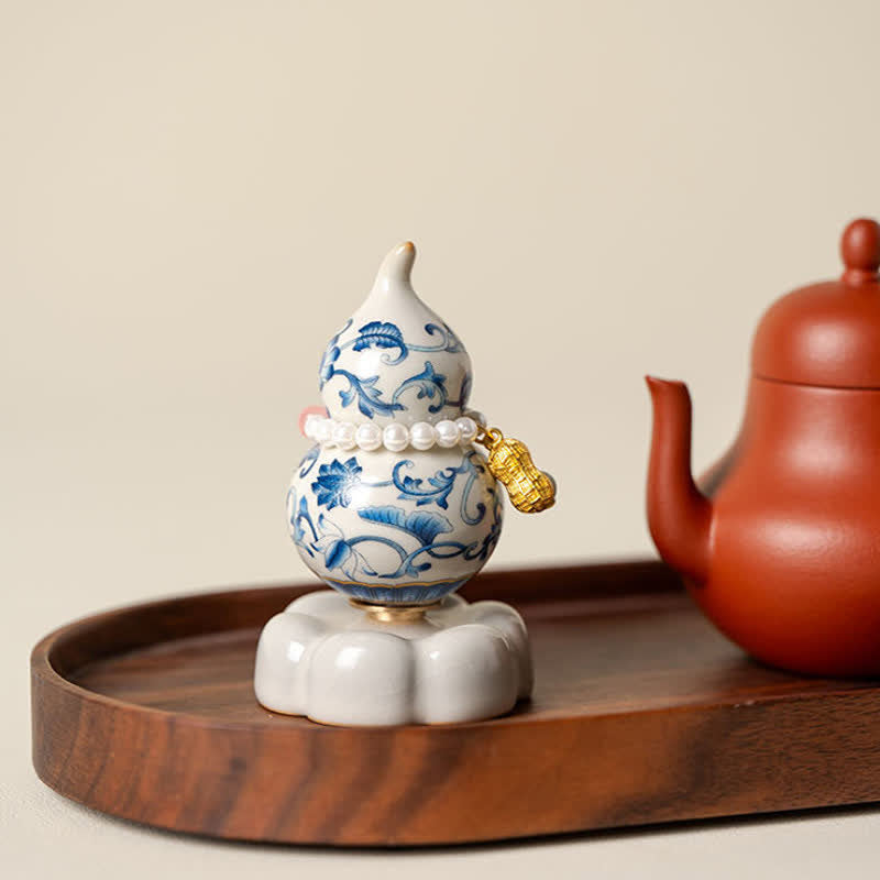 Buddha Stones Zucca girevole in ceramica blu e bianca a forma di loto, decorazione per uno stile di vita consapevole. - image 1