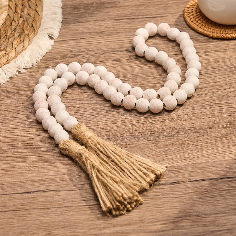 Buddha Stones Decorazione da appendere con doppia nappa e texture effetto legno screziato, stile Mindful Living. - image 1