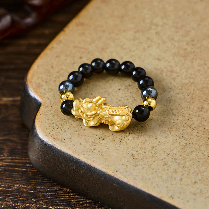 Buddha Stones Anello mini elasticizzato con perline in ossidiana nera, pirite, ematite, rame Pi Xiu per ricchezza ed energia - image 17
