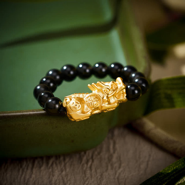 Buddha Stones Anello mini elasticizzato Pi Xiu in rame e ossidiana nera per forza ed energia - Taglia grande: corrisponde alle taglie americane 8-10 - image 0