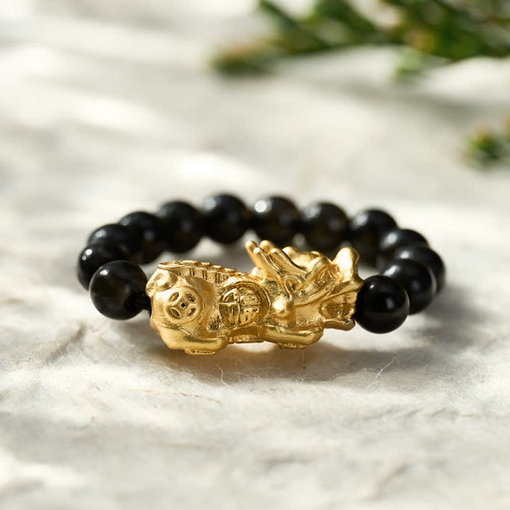 Buddha Stones Anello mini elasticizzato Pi Xiu in rame e ossidiana nera per forza ed energia - image 1