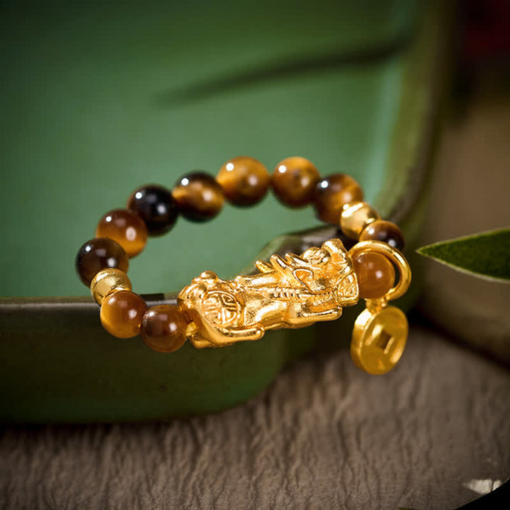 Buddha Stones Mini anello elastico con perline a forma di moneta cinese Tiger Eye Pi Xiu Wealth. - Corrisponde alle taglie americane 6-8 (52-55 mm) - image 0
