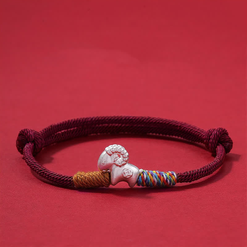 Buddha Stones Braccialetto portafortuna con pecora dello zodiaco cinese, anno della capra, in argento sterling 999, con cordino rosso intrecciato a mano. - image 1